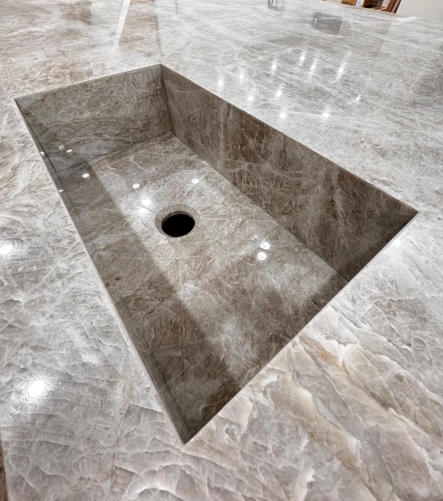Polished marble basin cut and shaped by waterjet