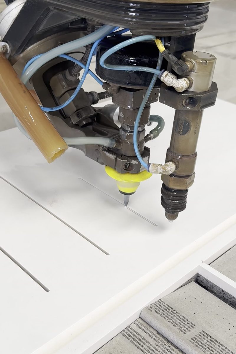 Flow Mach 200c waterjet cutting machine in operation