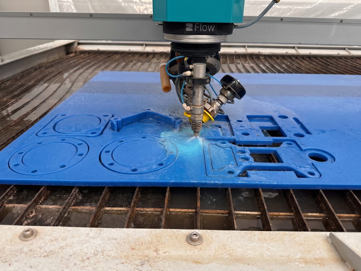 Waterjet cutting precision parts from industrial HDPE plastic sheet