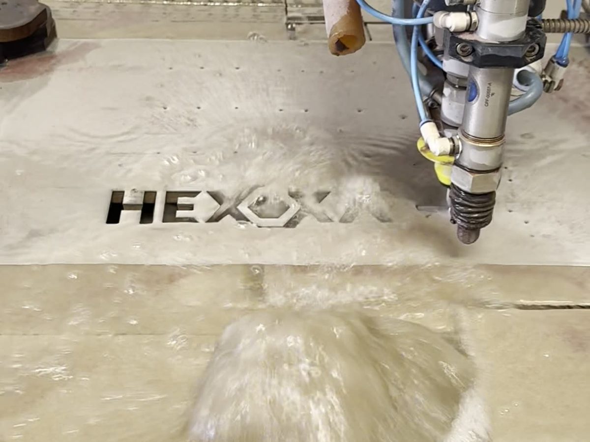 Flow Mach 200c precision waterjet cutting head in action